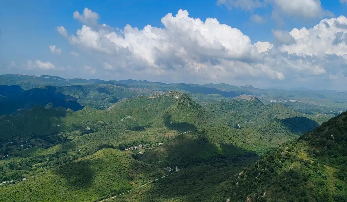 Sajjangarh Monsoon Palace perched on hilltop above Udaipur at sunset